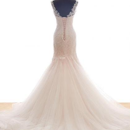 Bateau Sheer Mermaid Wedding Dress Featuring Lace..