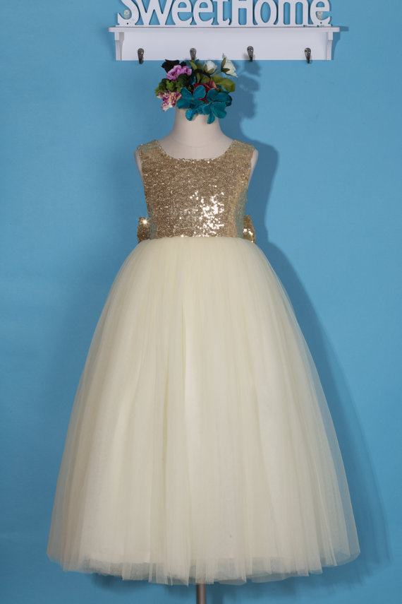 white flower girl dress with gold sash